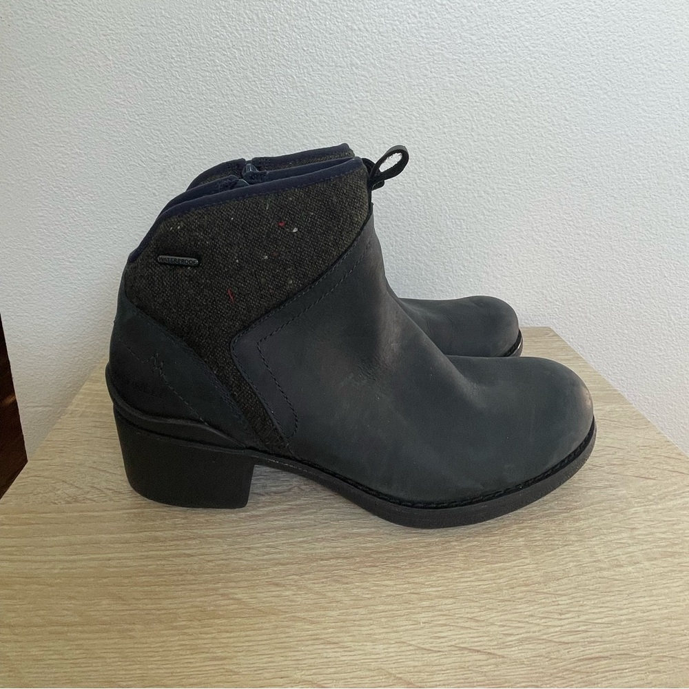 Black ankle combat/biker boots with a zipper on the side